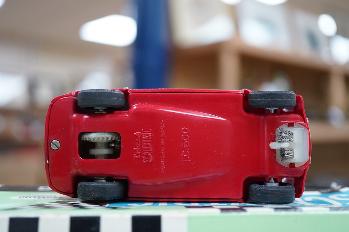A boxed Tri-ang Scalextric T. C. Seat 600 (C-31) in red, with correct red spot box, together with an unboxed Hurricane combination motorcycle and sidecar MM/82